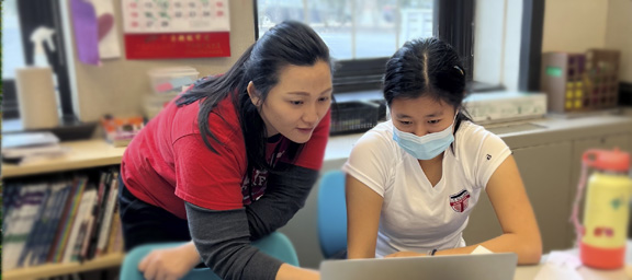 Bao helping a student